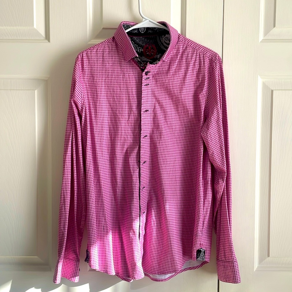 Pink long sleeve button up shirt with black and white designs